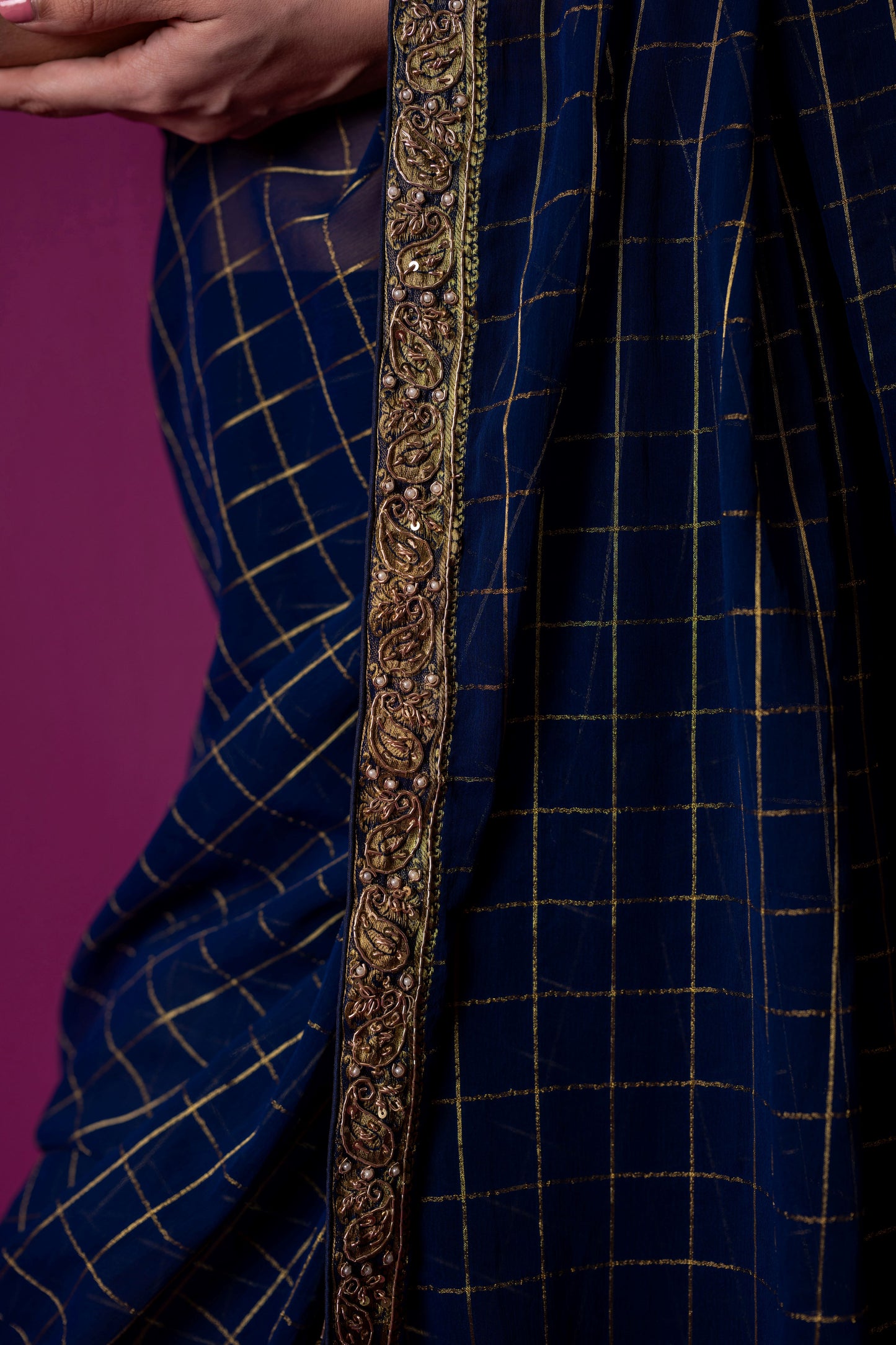 A Navy Gold Checkered Saree with Fuchsia Corset Blouse